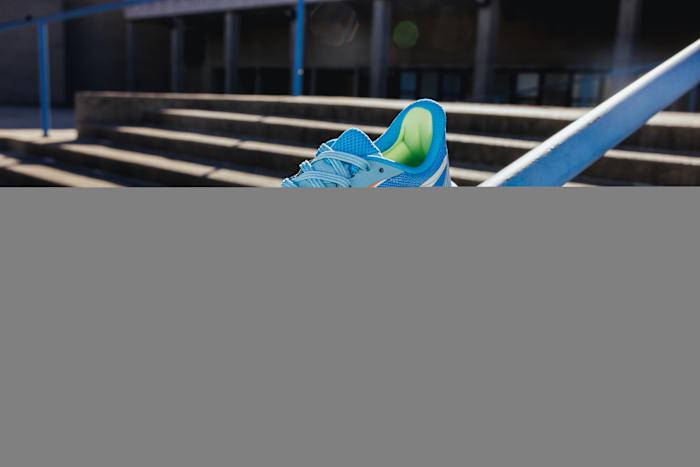 View of blue and white Reebok shoe.